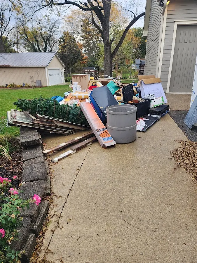 Dumpster being loaded with debris for 10 Yard Dumpster Rental in Yazoo City